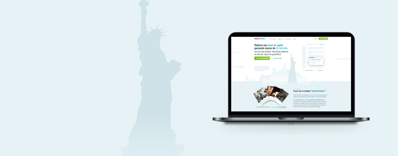 Ao lado da silhueta da Estátua da Liberdade, temos um notebook com a tela inicial da plataforma Graded Readers.